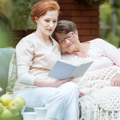 lady reading to the elderly